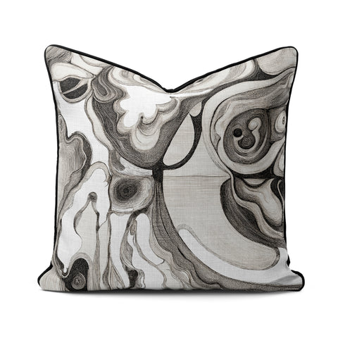 Interior Drift Object I contemporary textile cushion with monochrome abstract design on neutral sofa