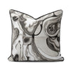 Interior Drift Object I contemporary textile cushion with monochrome abstract design on neutral sofa
