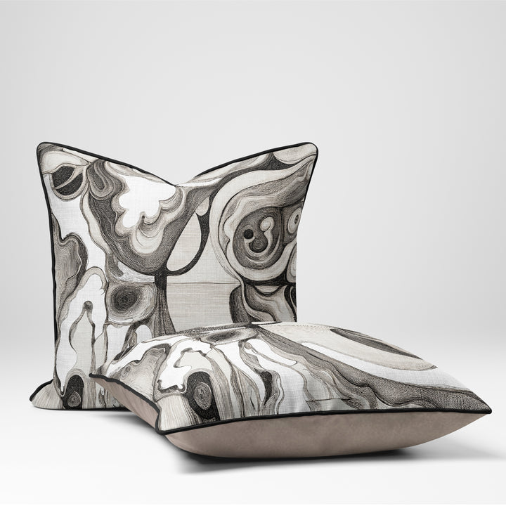 Interior Drift Object I contemporary textile cushion with monochrome abstract design on neutral sofa

